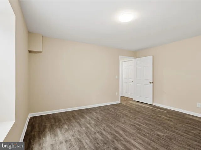 a view of a white house with a yard