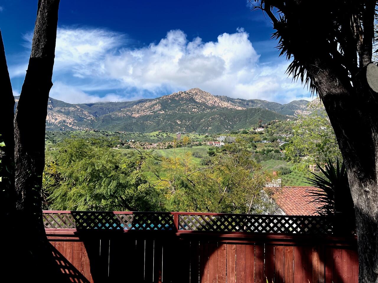 a view of a yard from a balcony