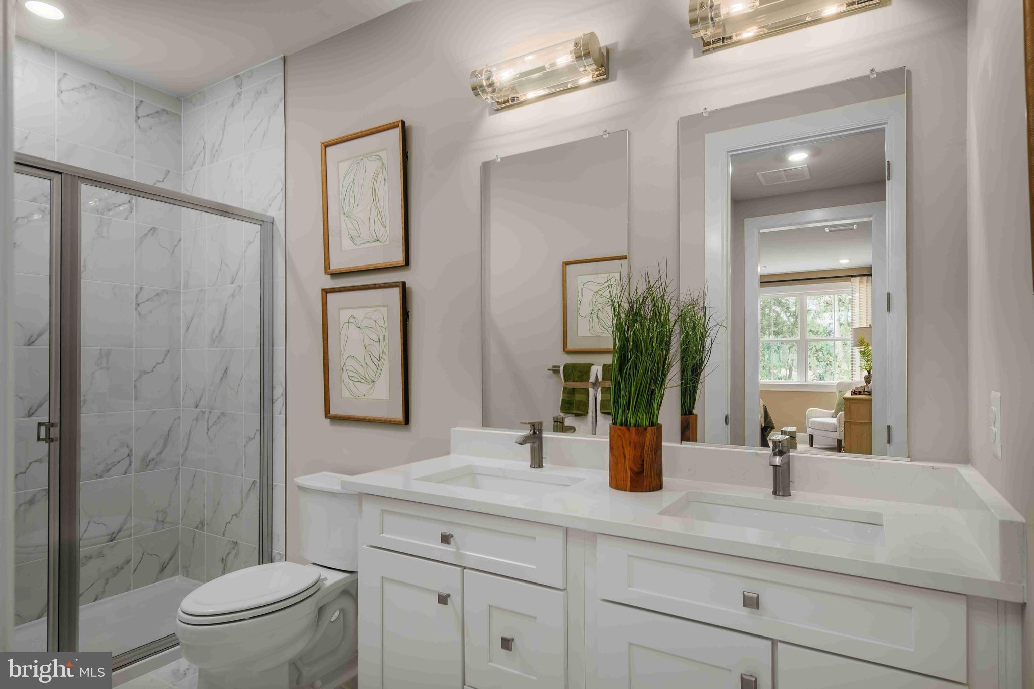 5446 Pondview Lane Ellicott City, MD 21043 - Photo 19 of 21 a bathroom with a double vanity sink toilet and shower