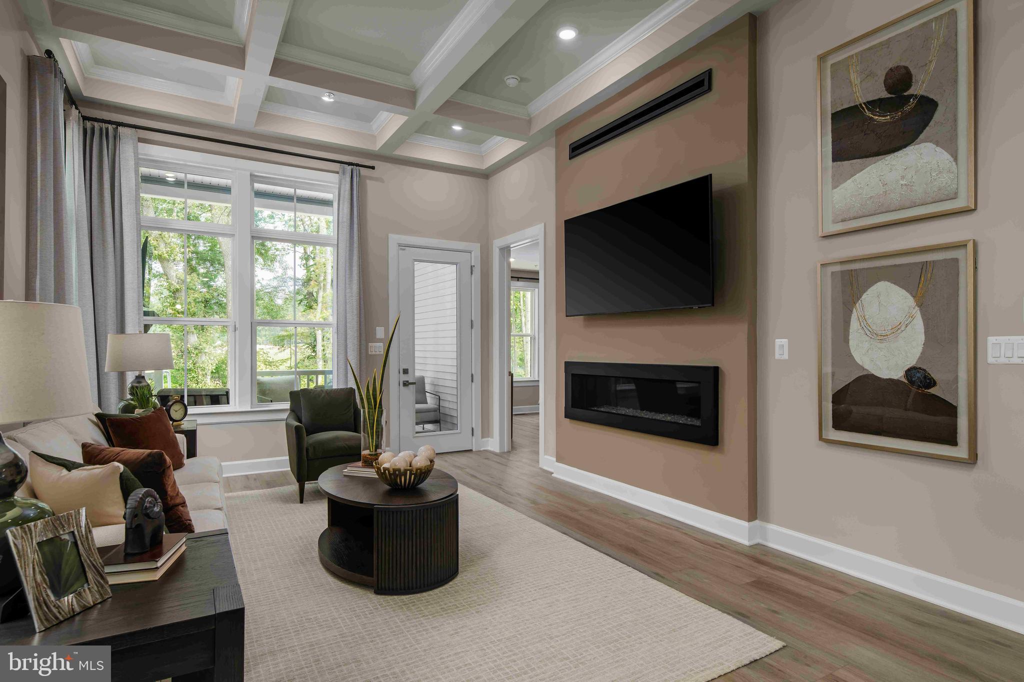 5446 Pondview Lane Ellicott City, MD 21043 - Photo 5 of 21 a living room with furniture a flat screen tv and a fireplace