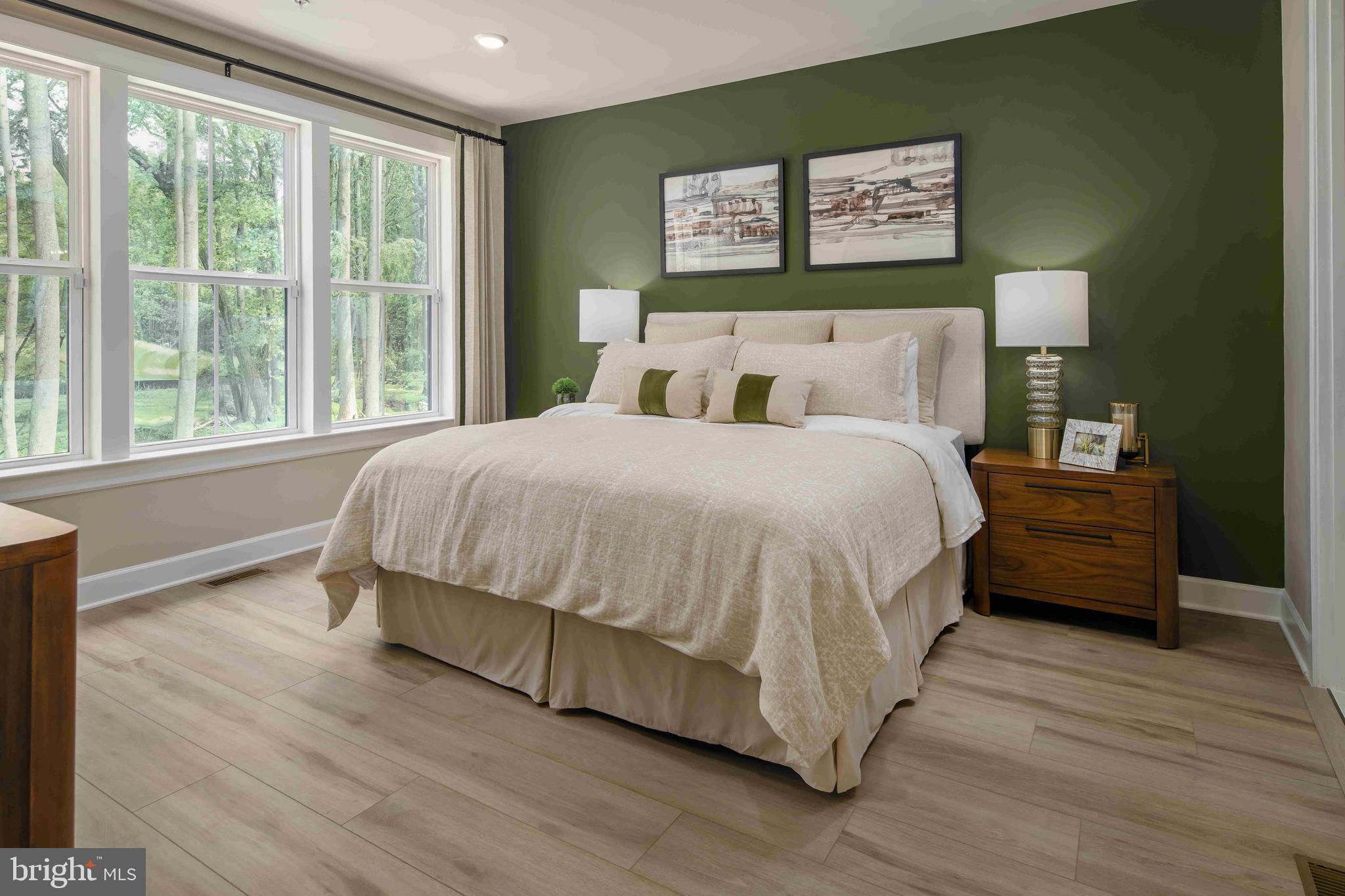 5446 Pondview Lane Ellicott City, MD 21043 - Photo 7 of 21 a bedroom with a bed wooden floor and window