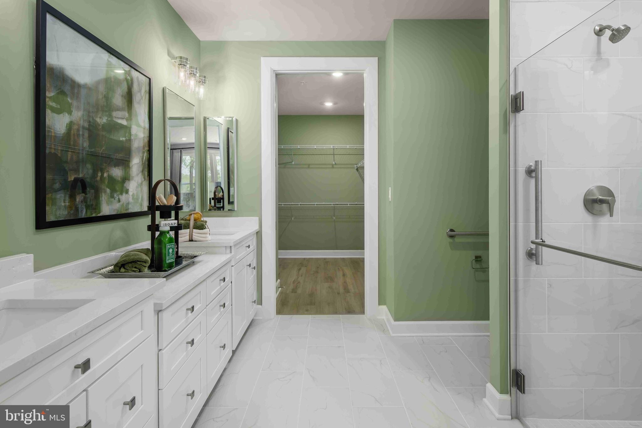 5446 Pondview Lane Ellicott City, MD 21043 - Photo 8 of 21 a bathroom with a granite countertop shower sink and mirror