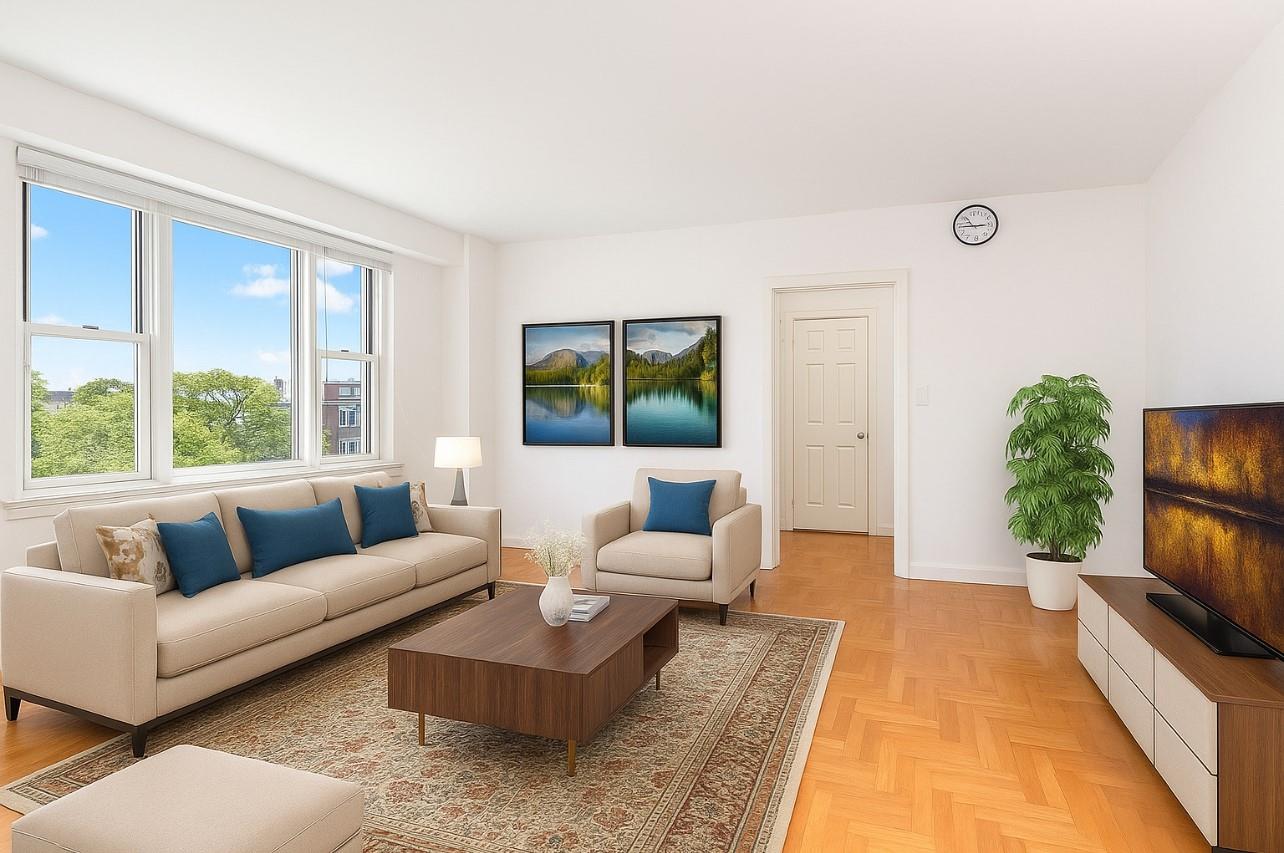 a living room with furniture and a flat screen tv