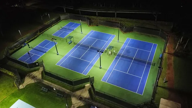 an aerial view of a pool patio fire pit and outdoor kitchen