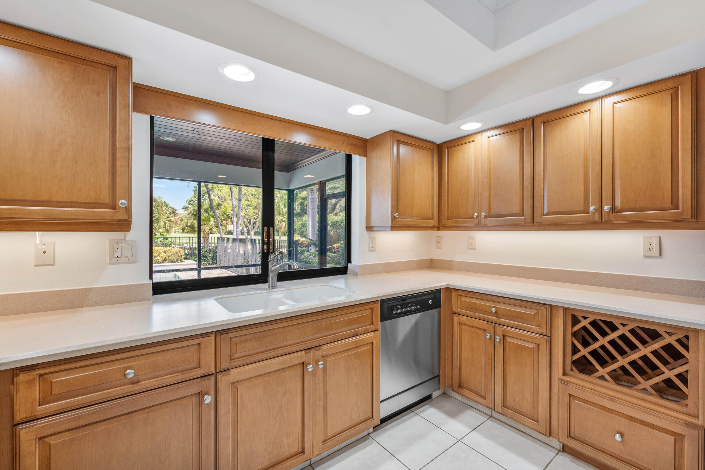 1851 Thatch Palm Drive Boca Raton, FL 33432 - Photo 27 of 70 a kitchen with white cabinets and white appliances