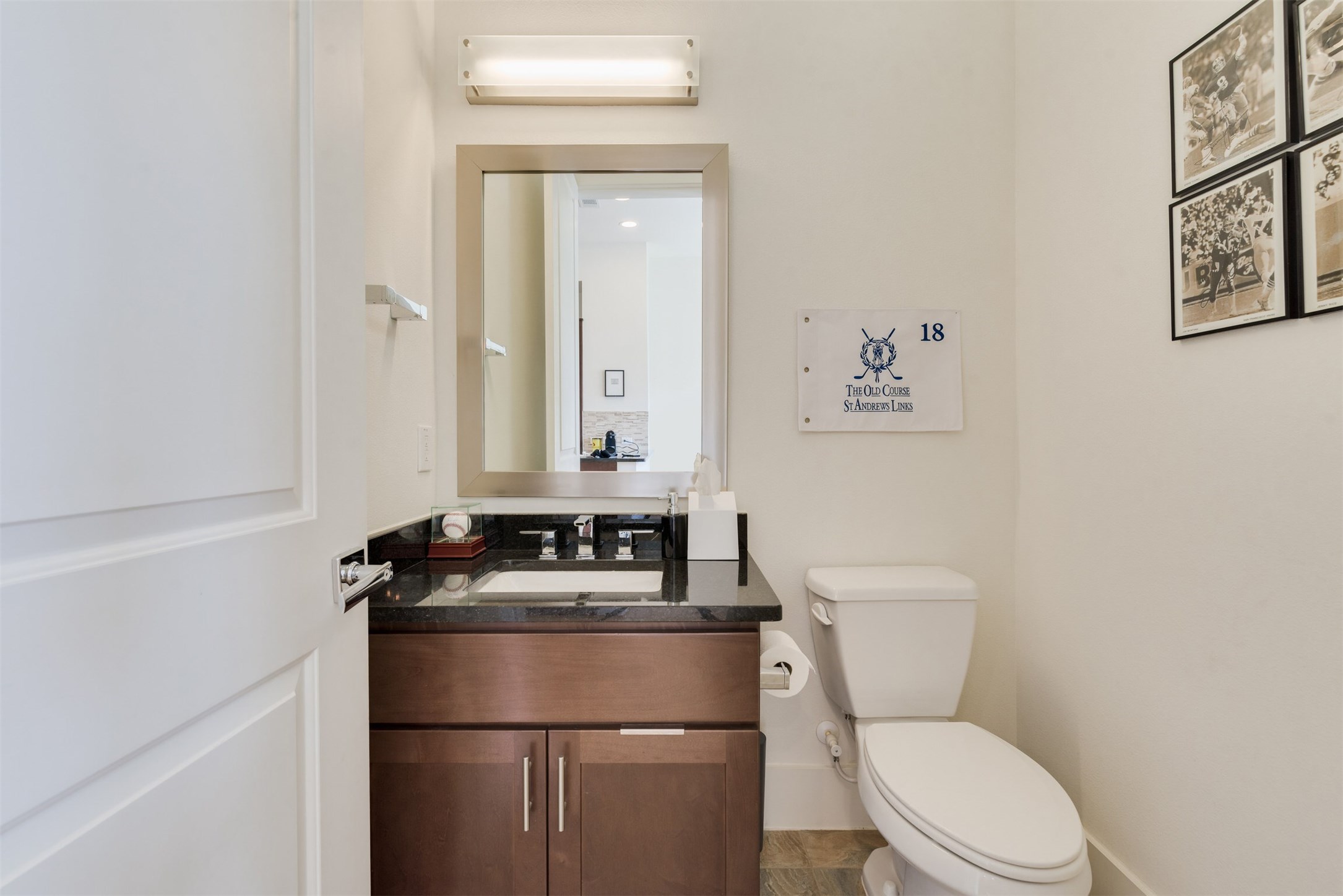5429 Hidalgo Street, Unit B Houston, TX 77056 - Photo 18 of 38 a white toilet sitting next to a bathroom sink
