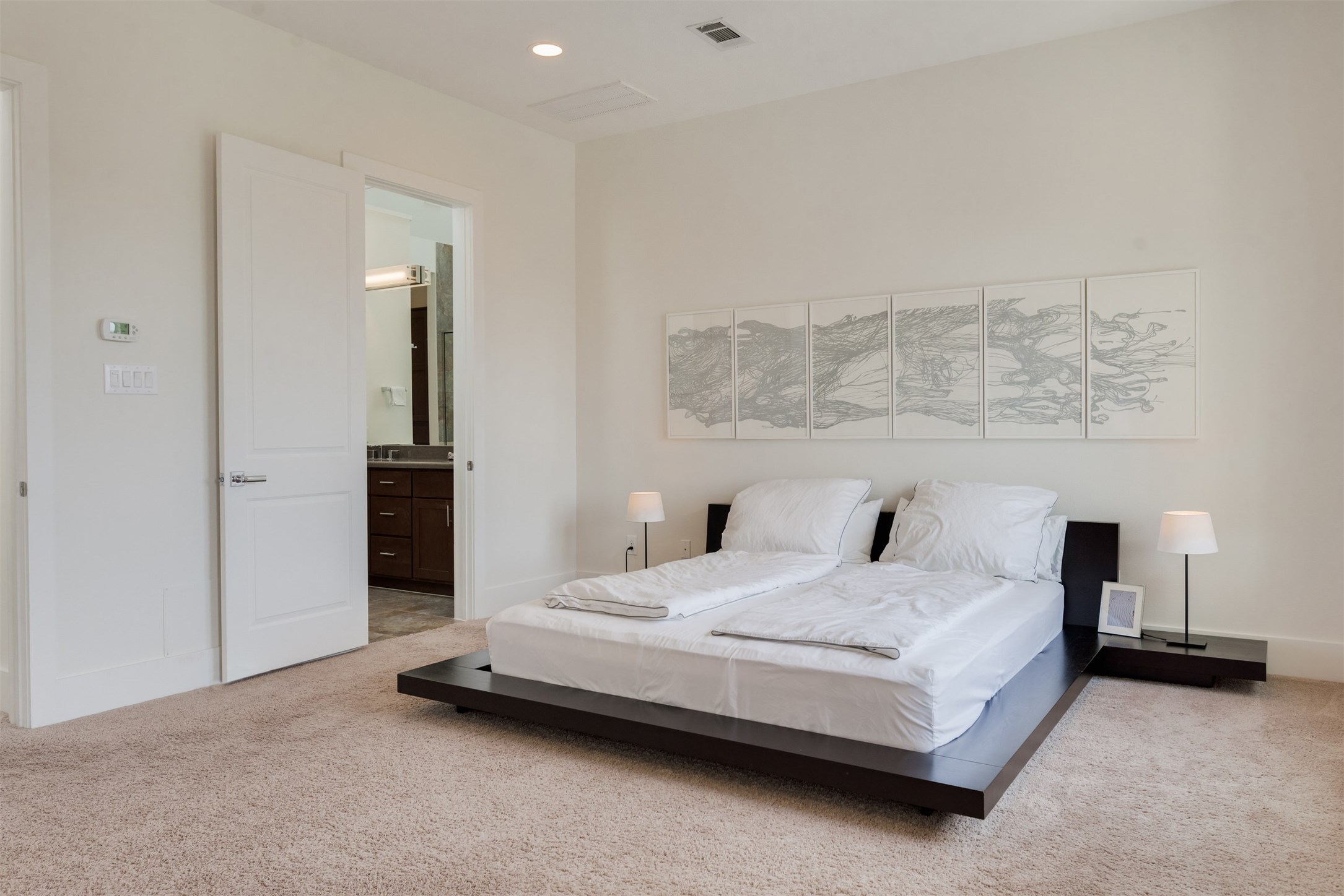 5429 Hidalgo Street, Unit B Houston, TX 77056 - Photo 20 of 38 a bedroom with a bed and a night stand