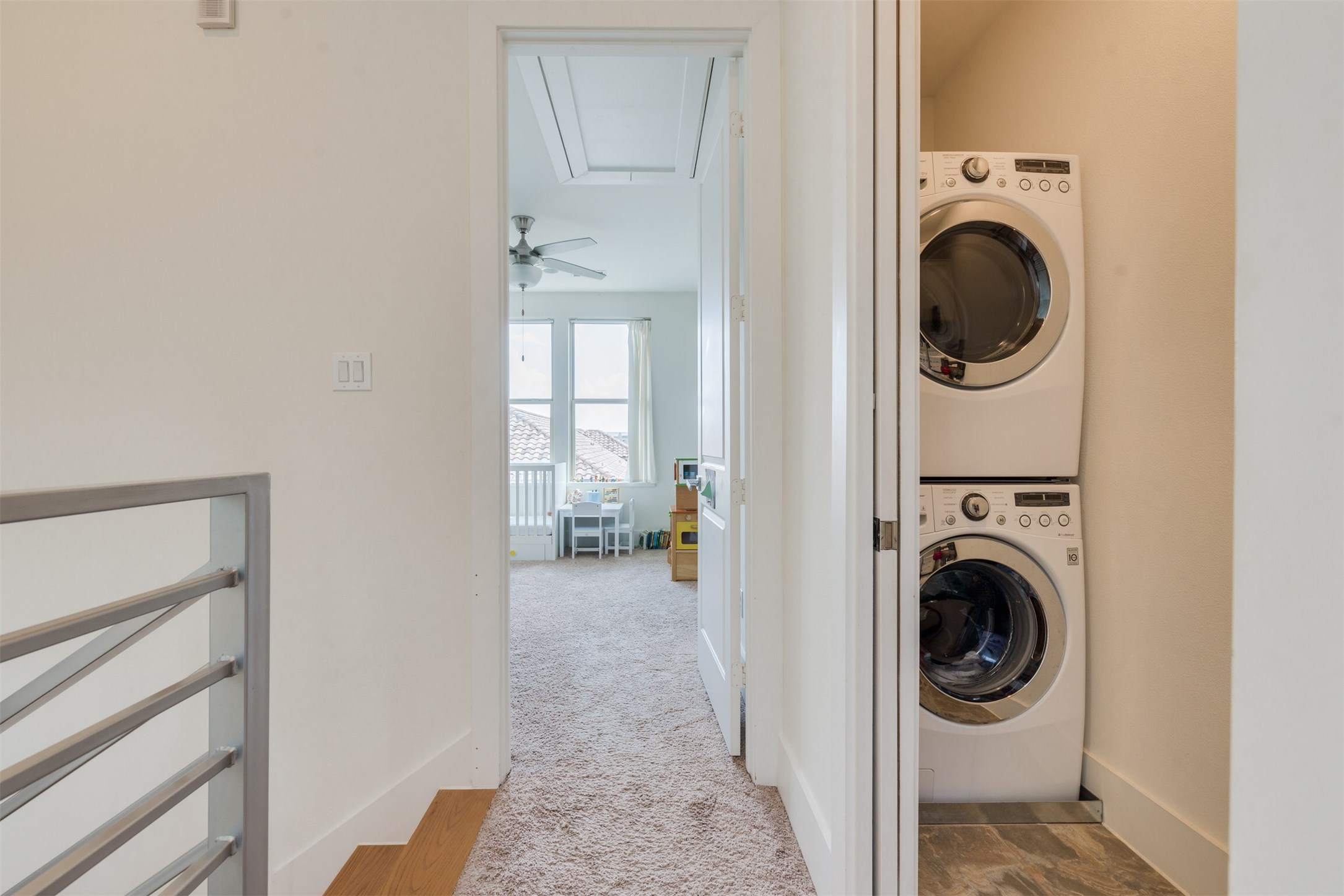 5429 Hidalgo Street, Unit B Houston, TX 77056 - Photo 32 of 38 a view of a hallway with washer and dryer