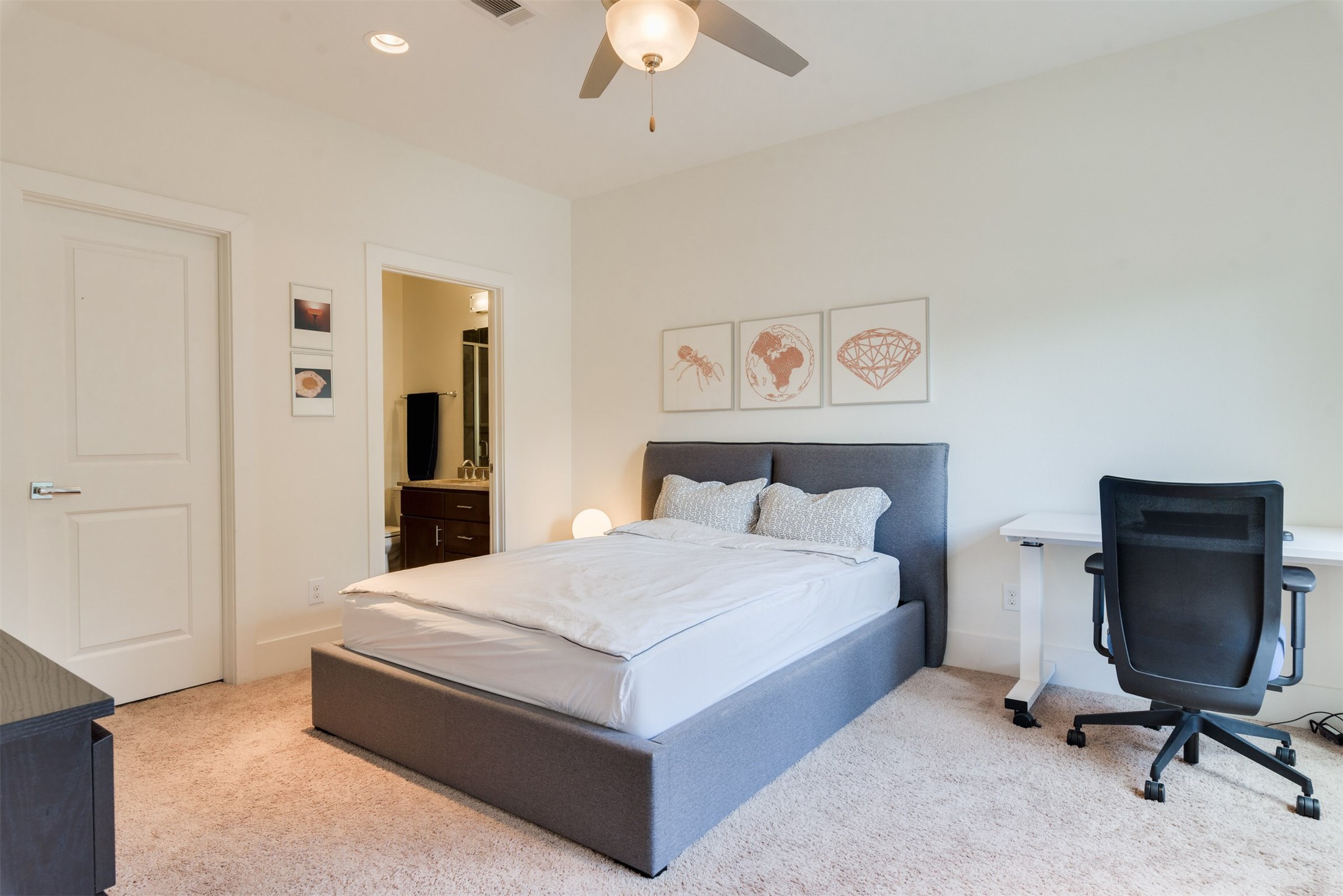 5429 Hidalgo Street, Unit B Houston, TX 77056 - Photo 34 of 38 a bedroom with a bed and a chandelier