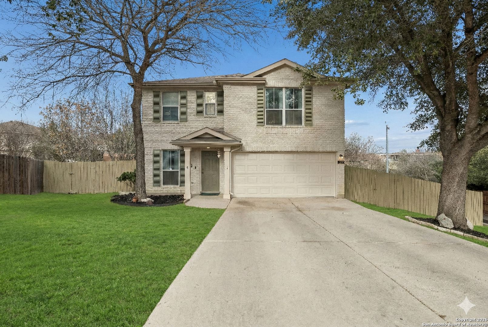 10310 Springwood Square Universal City, TX 78148 - Photo 2 of 44 a front view of a house with garden