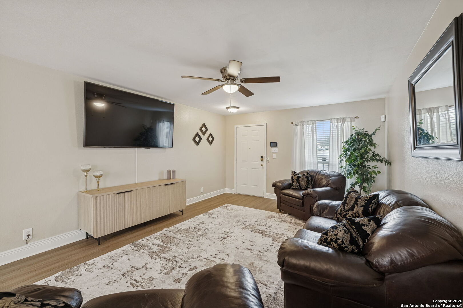 10310 Springwood Square Universal City, TX 78148 - Photo 6 of 44 a living room with furniture and a flat screen tv