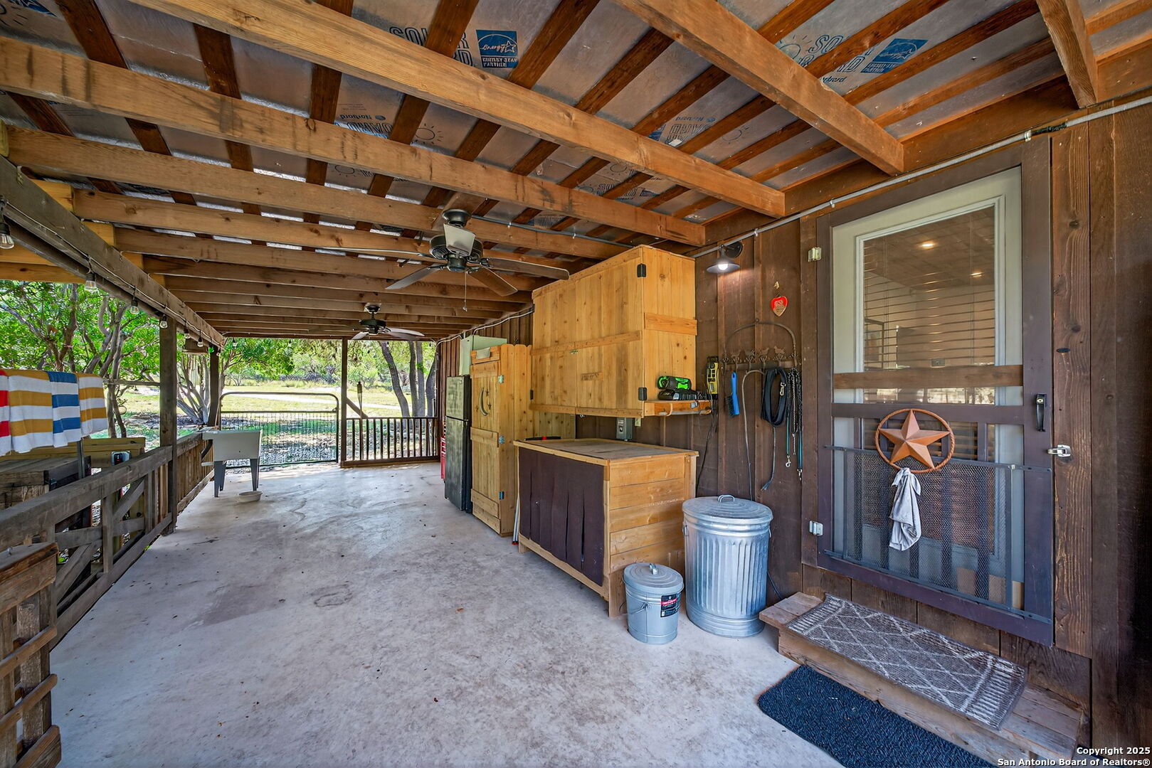 924 Wagon Creek Road Bandera, TX 78003 - Photo 16 of 33 a room with lot of furniture and a window