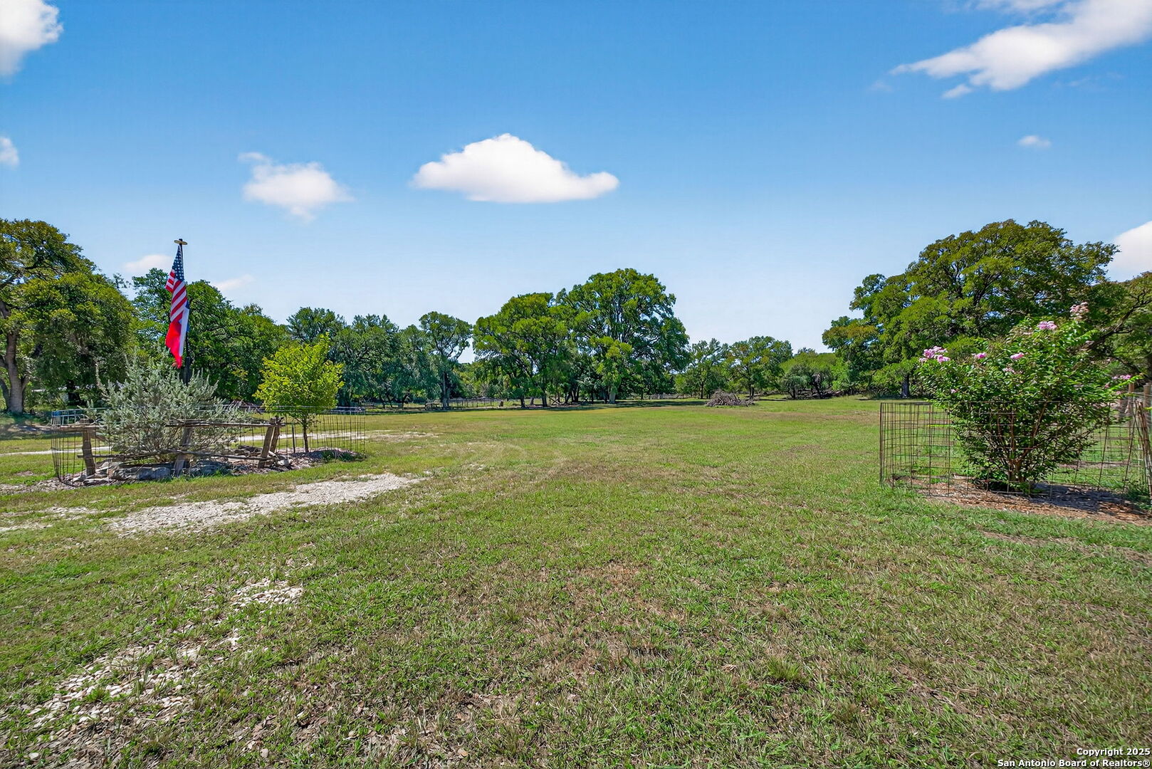 924 Wagon Creek Road Bandera, TX 78003 - Photo 20 of 33 a view of a golf course with a lake
