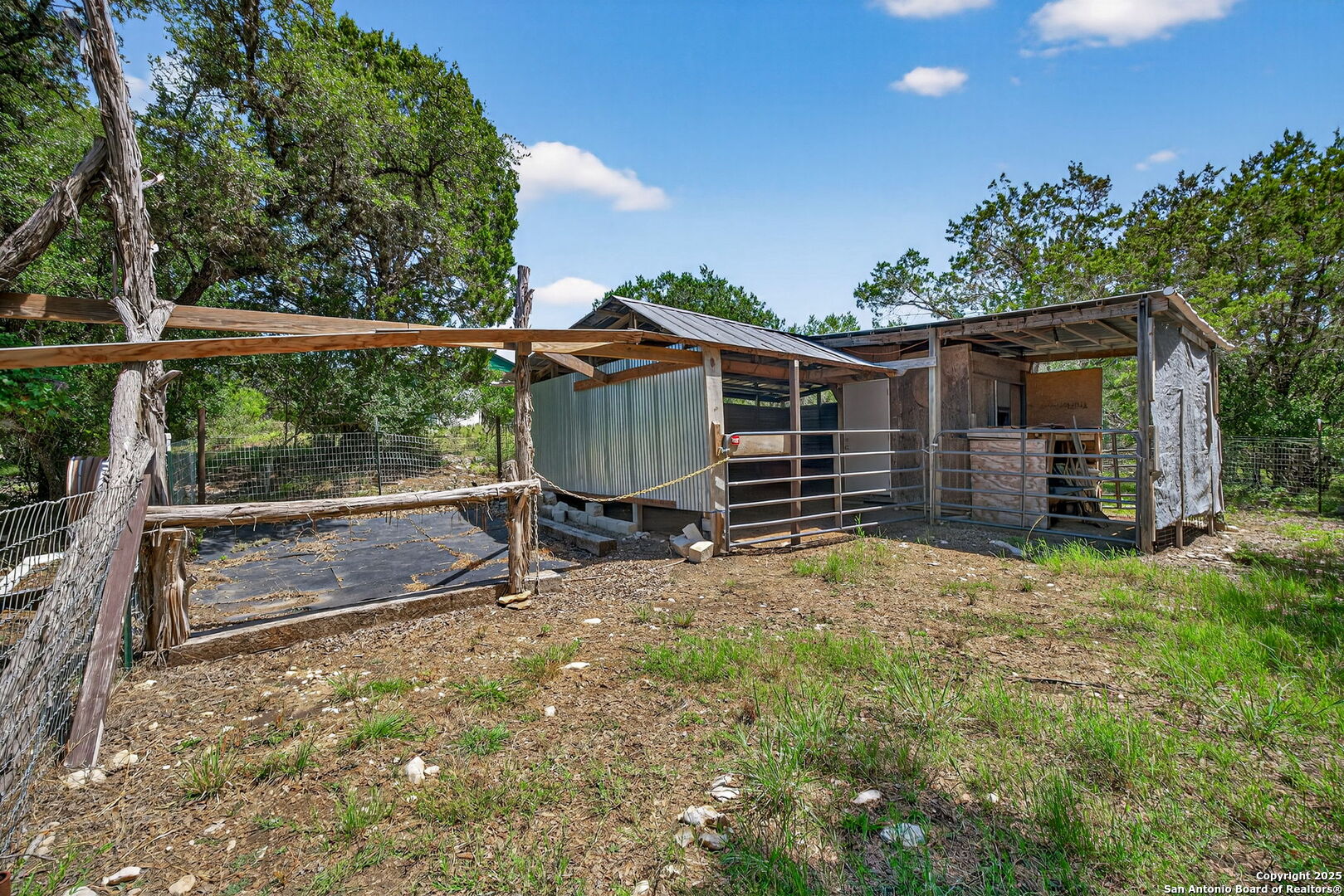 924 Wagon Creek Road Bandera, TX 78003 - Photo 25 of 33 a view of backyard and wooden fence