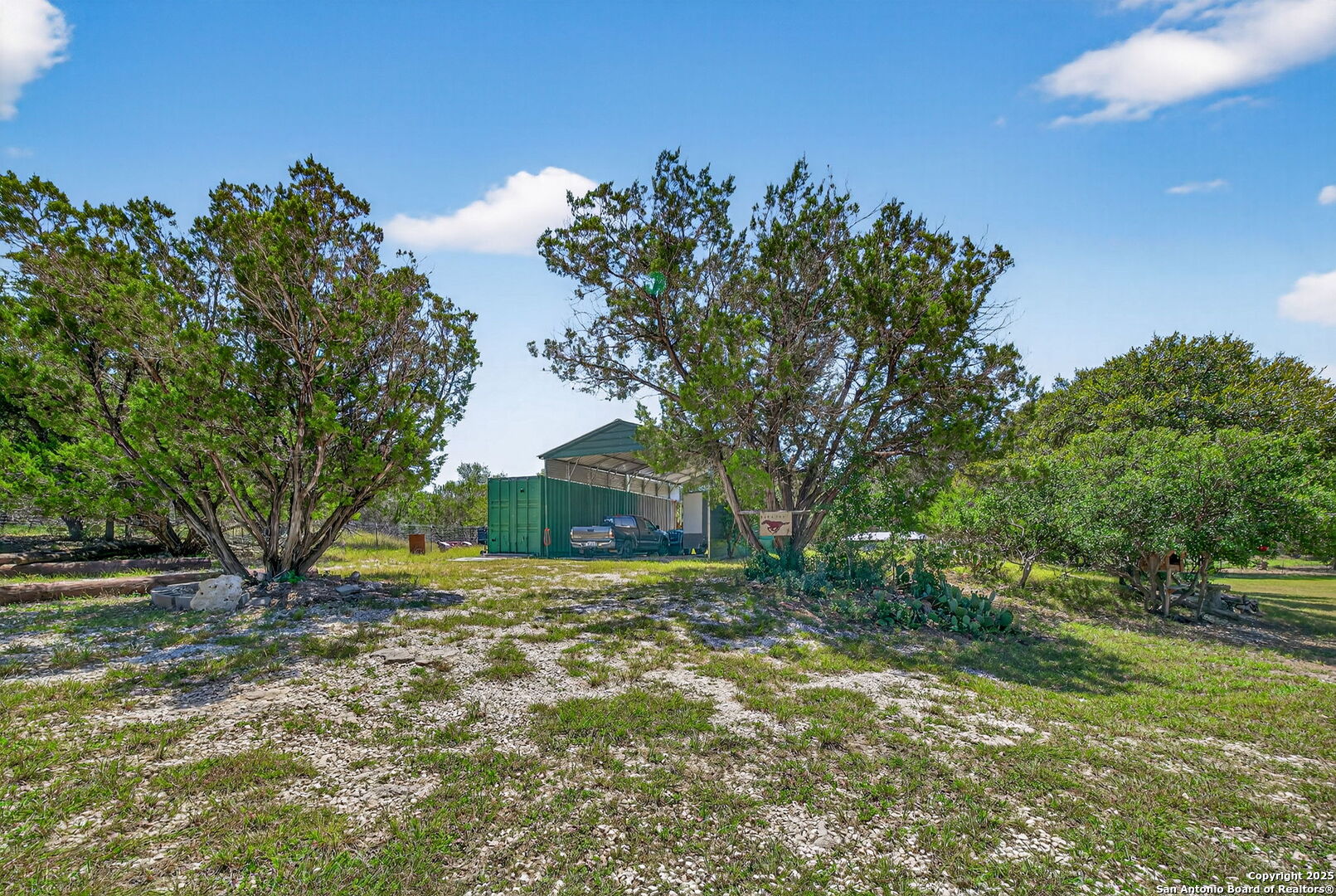 924 Wagon Creek Road Bandera, TX 78003 - Photo 33 of 33 a view of a yard with plants and trees
