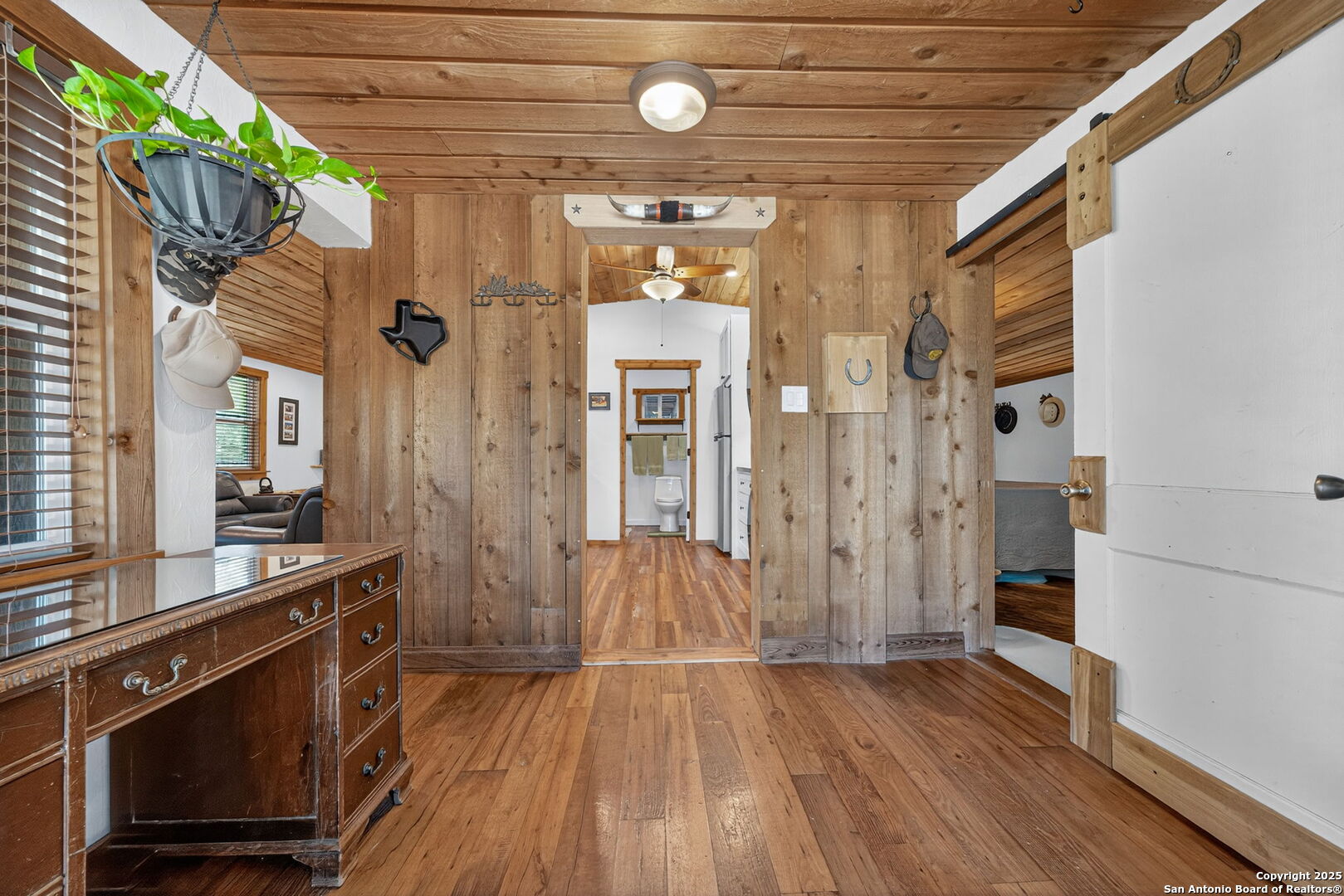 924 Wagon Creek Road Bandera, TX 78003 - Photo 5 of 33 a view of an entryway door with wooden floor