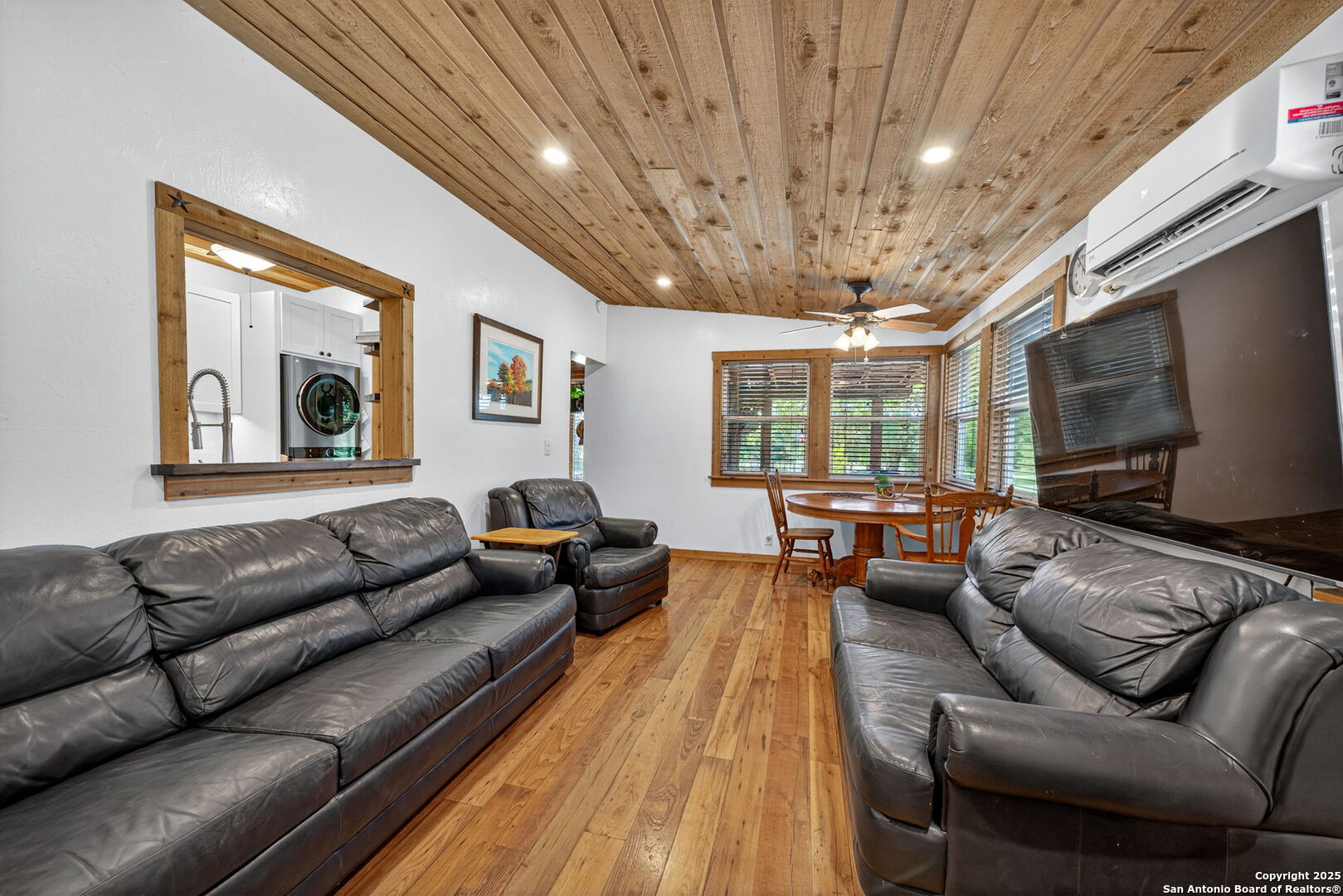 924 Wagon Creek Road Bandera, TX 78003 - Photo 8 of 33 a living room with furniture and a flat screen tv