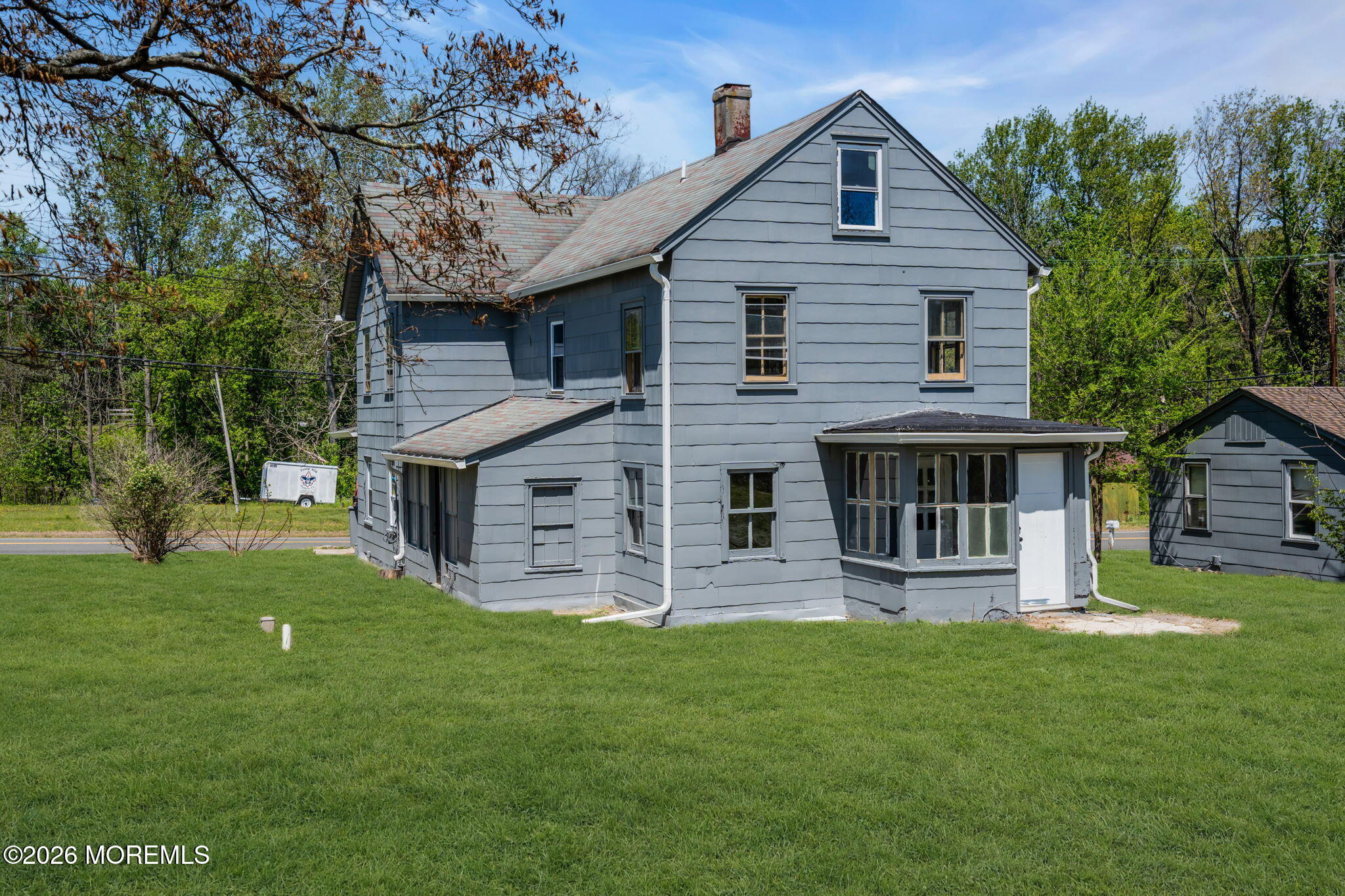 9 Arneytown-Hornerstown Road Cream Ridge, NJ 08514 - Photo 53 of 58 a front view of a house with a yard and green space