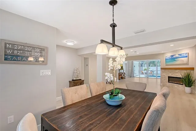 a view of a dining room with furniture and window