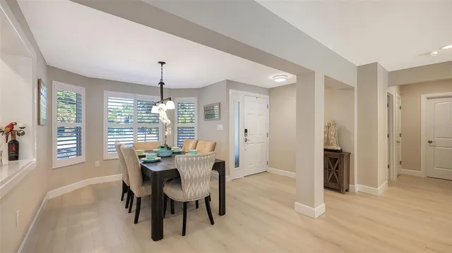 a kitchen with white cabinets and appliances