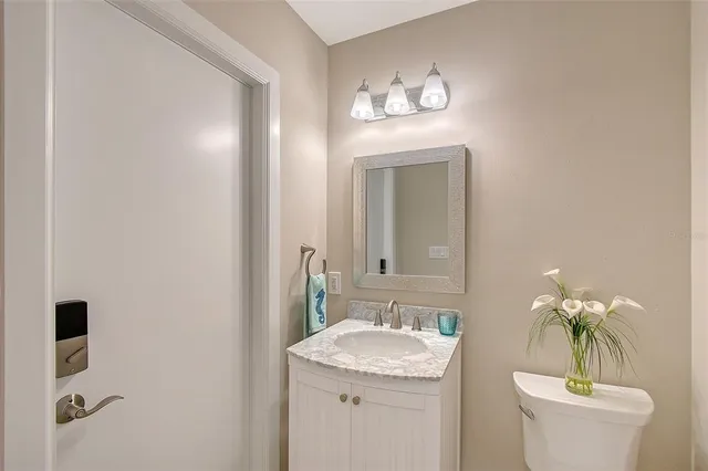 a bathroom with a double vanity sink mirror and shower
