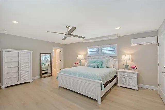 a view of an empty room with a window and a ceiling fan