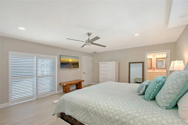 a bathroom with a sink a toilet and a shower