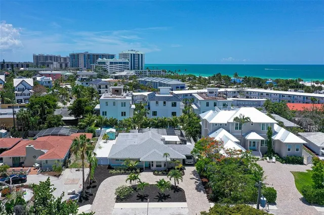 an aerial view of a house with a garden