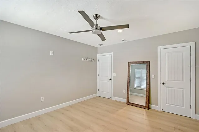 a view of a backyard with swimming pool