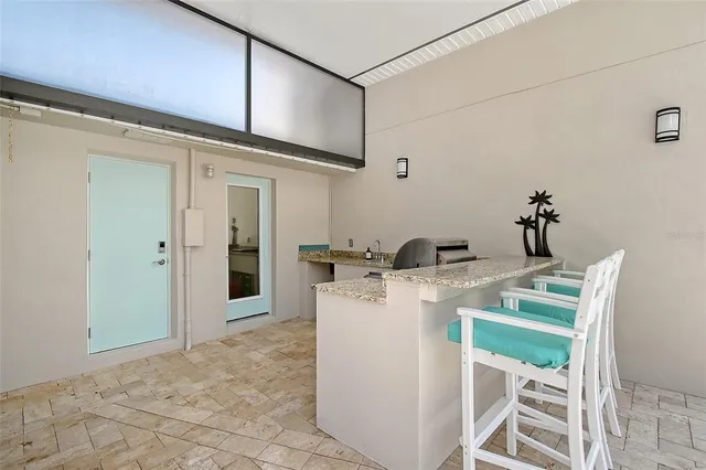 a view of swimming pool with outdoor seating