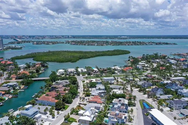 a front view of a multi story building with yard