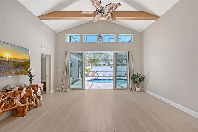 a view of a livingroom with furniture and a flat screen tv