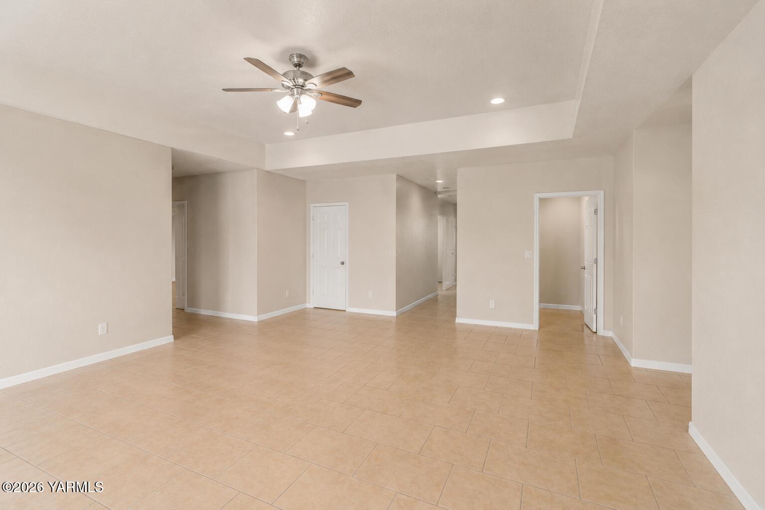 1811 Beam Road Granger, WA 98932 - Photo 8 of 26 a view of an empty room with a ceiling fan