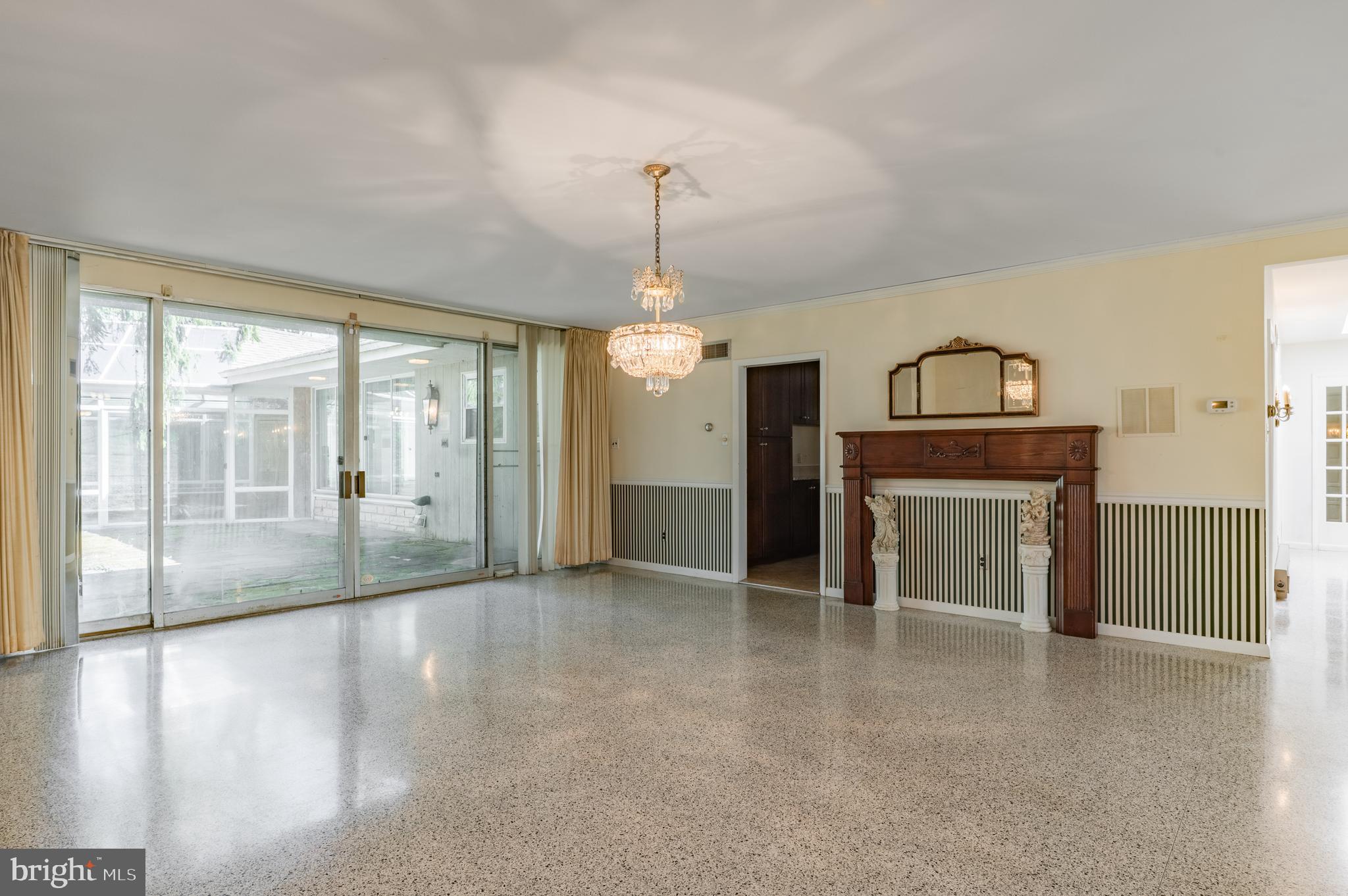1211 East Butler Pike Ambler, PA 19002 - Photo 24 of 76 a view of an empty room with glass door and a window