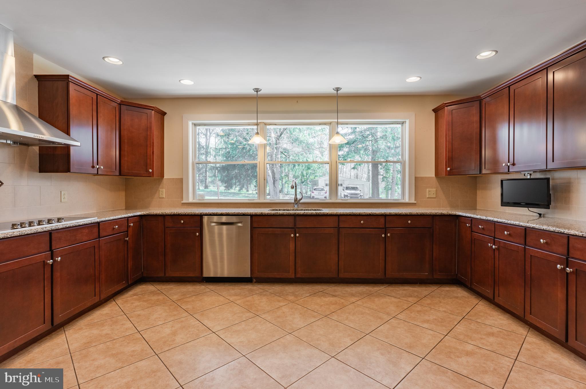 1211 East Butler Pike Ambler, PA 19002 - Photo 27 of 76 a kitchen with a sink window and cabinets