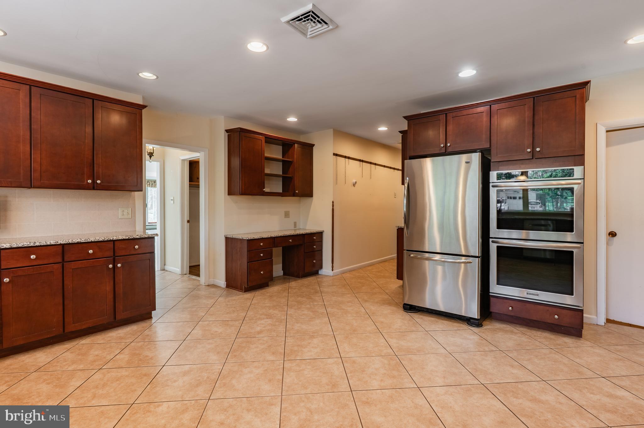 1211 East Butler Pike Ambler, PA 19002 - Photo 28 of 76 a kitchen with stainless steel appliances a refrigerator and a stove top oven