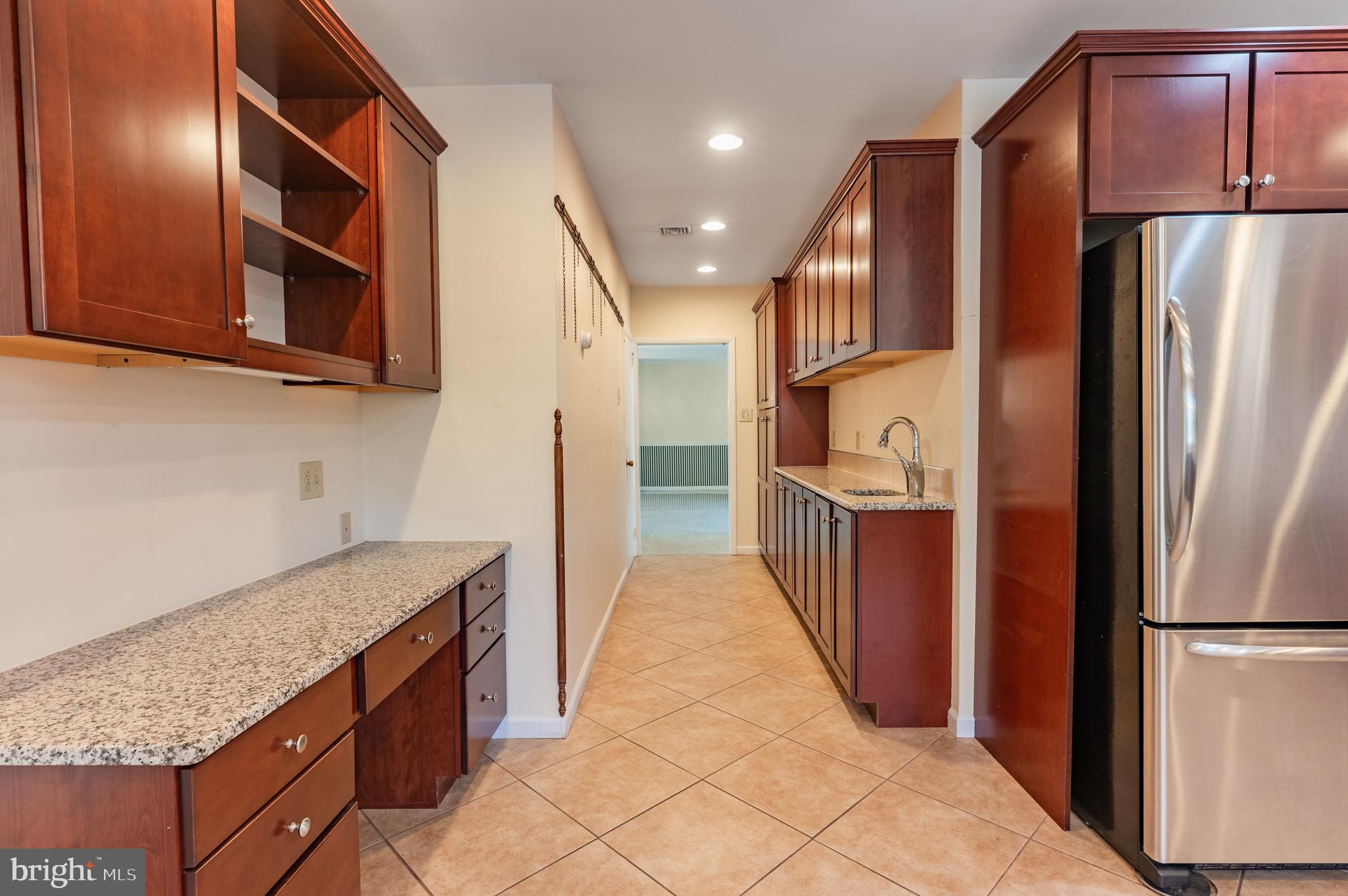 1211 East Butler Pike Ambler, PA 19002 - Photo 30 of 76 a kitchen with stainless steel appliances granite countertop a refrigerator and a sink
