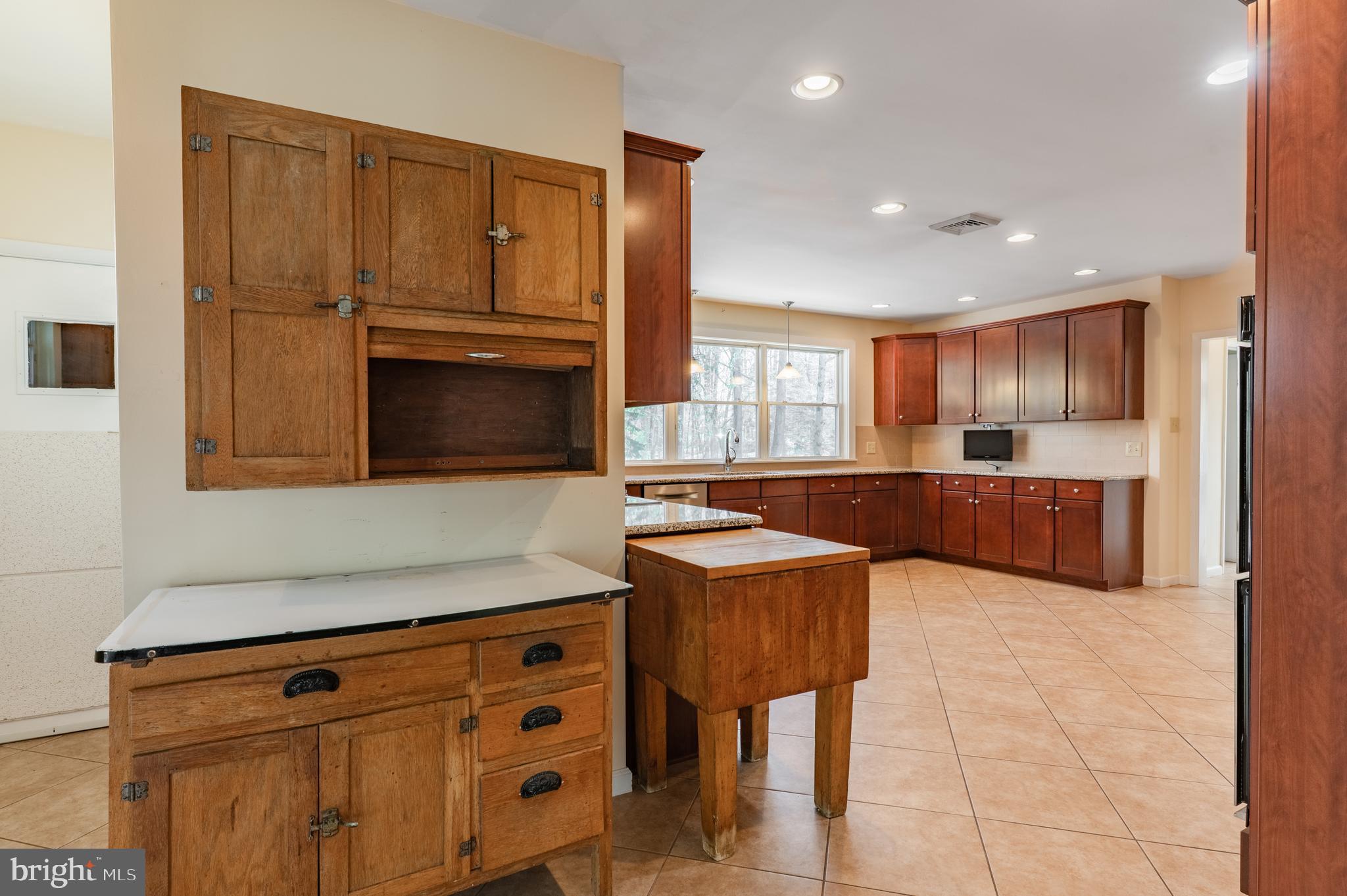 1211 East Butler Pike Ambler, PA 19002 - Photo 34 of 76 a kitchen with granite countertop a stove and a refrigerator