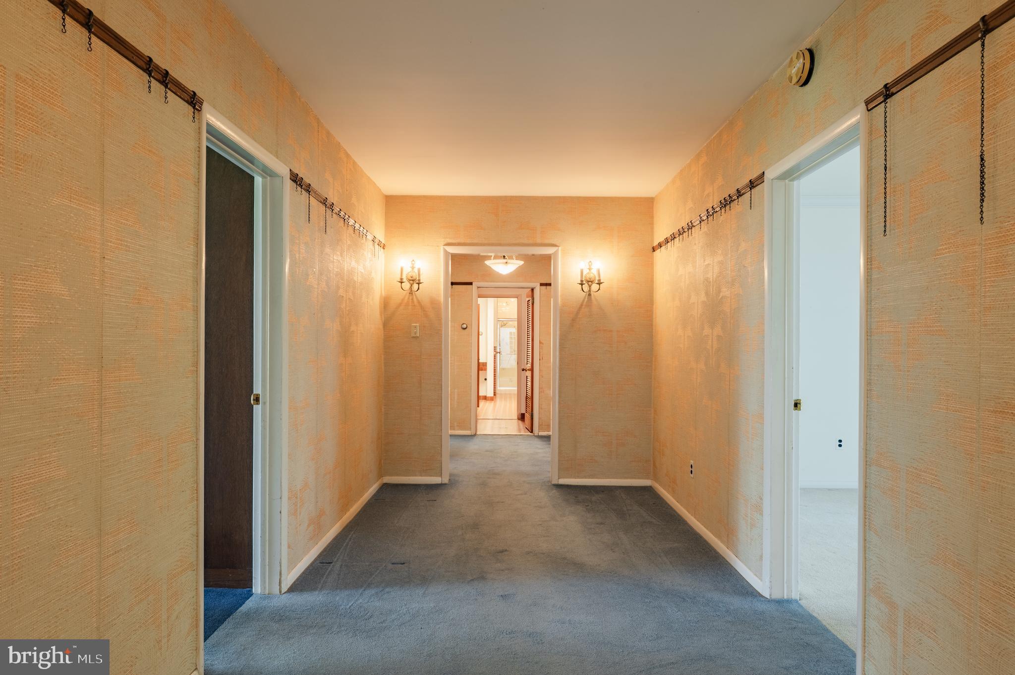 1211 East Butler Pike Ambler, PA 19002 - Photo 37 of 76 a view of a hallway with wooden shelves