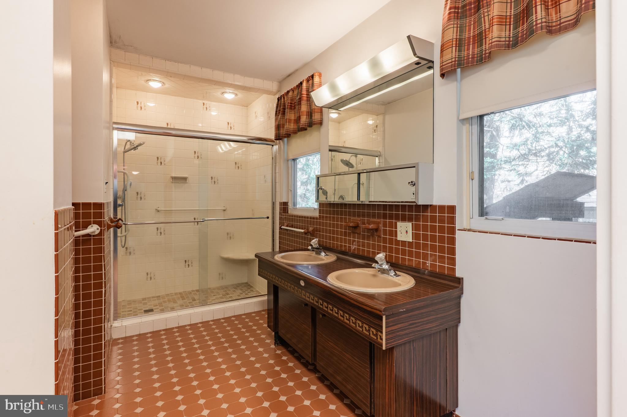 1211 East Butler Pike Ambler, PA 19002 - Photo 47 of 76 a kitchen with granite countertop a stove and a refrigerator