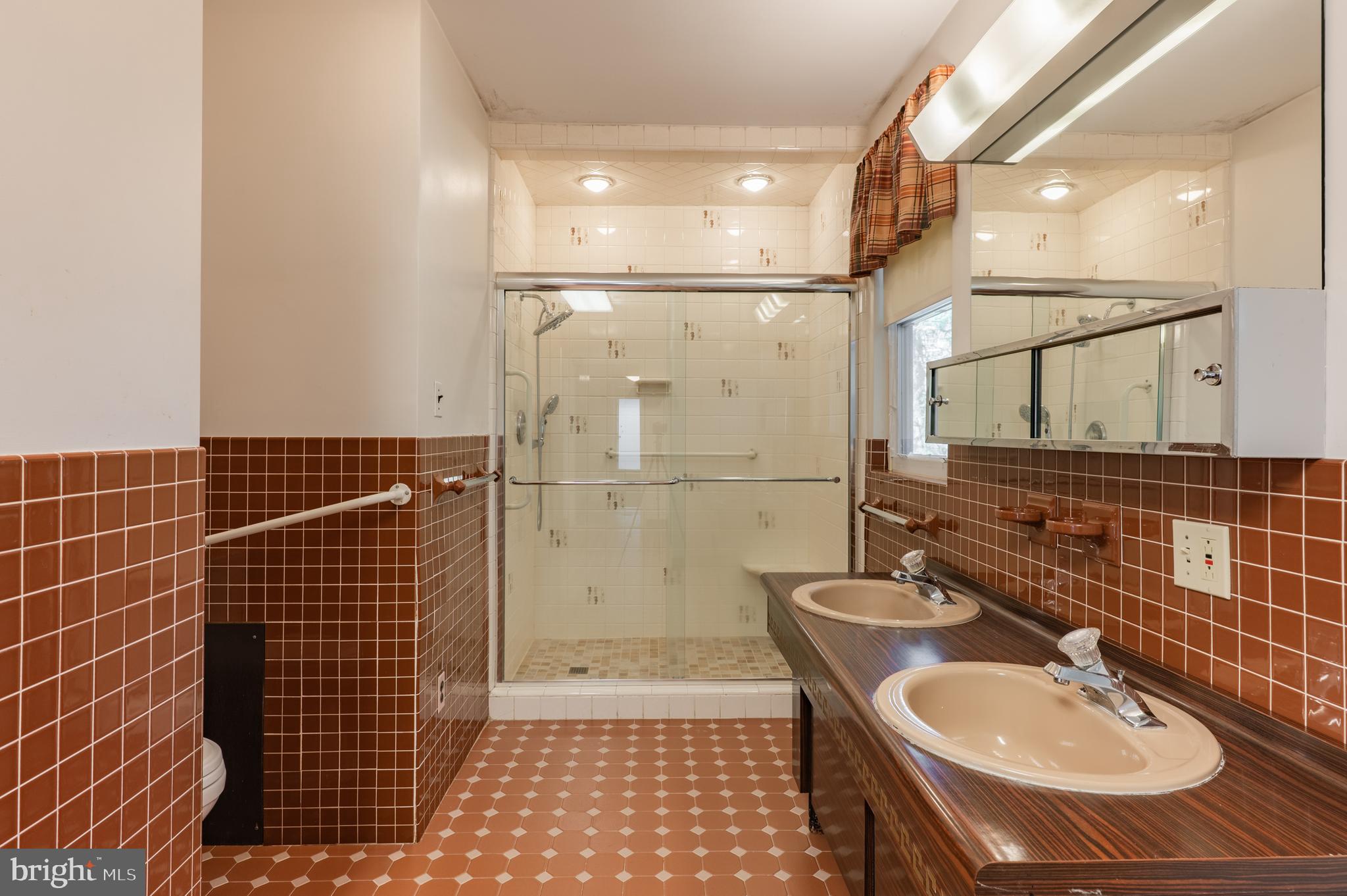 1211 East Butler Pike Ambler, PA 19002 - Photo 49 of 76 a bathroom with a sink toilet and shower