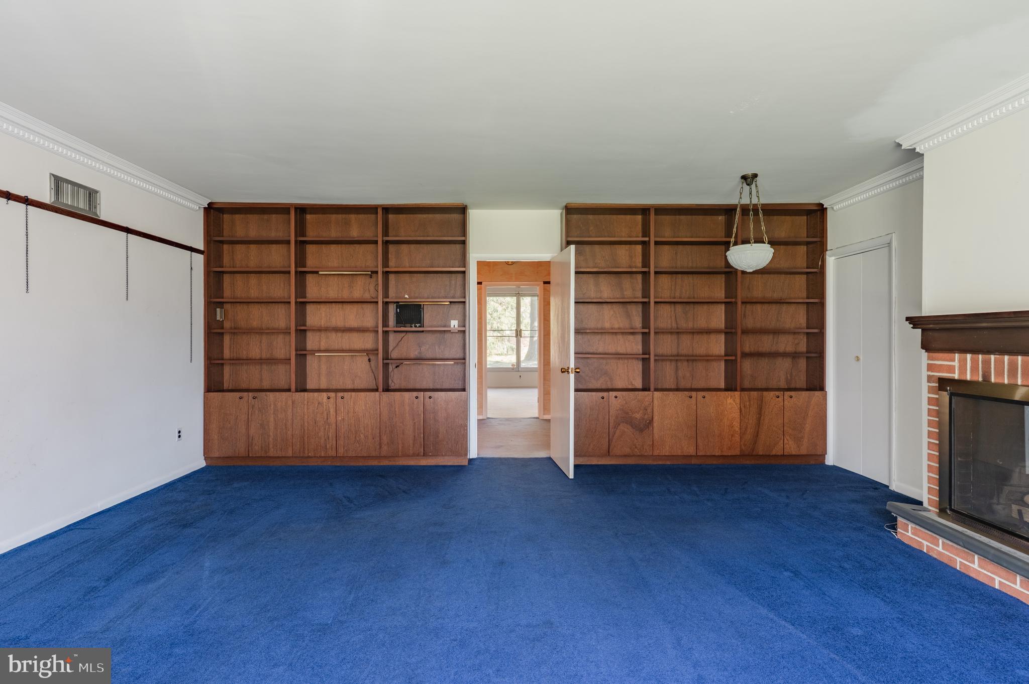 1211 East Butler Pike Ambler, PA 19002 - Photo 54 of 76 a view of an empty room with wooden floor and cabinet