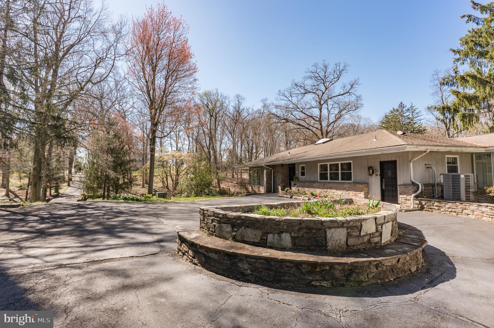 1211 East Butler Pike Ambler, PA 19002 - Photo 72 of 76 a front view of a house with a garden