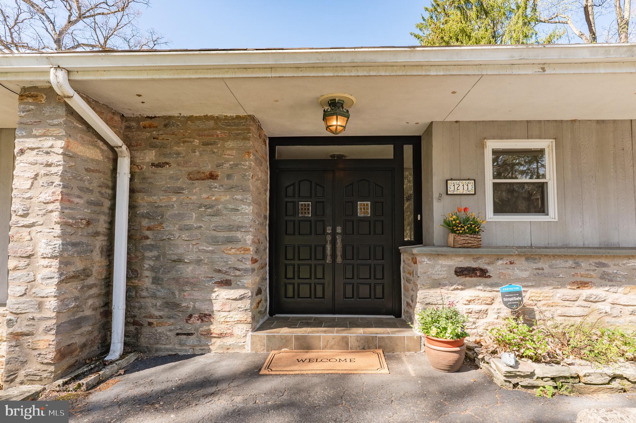 1211 East Butler Pike Ambler, PA 19002 - Photo 9 of 76 a front view of a house with a yard