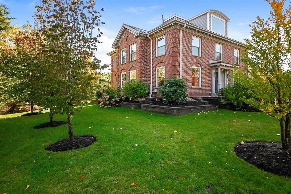 2-4 Evergreen Avenue Newton, MA 02466 - Photo 1 of 42 a front view of a house with a yard