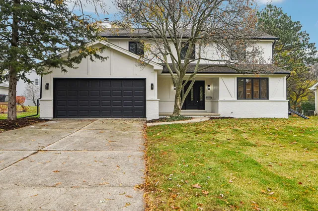 a house that has a tree in front of the house