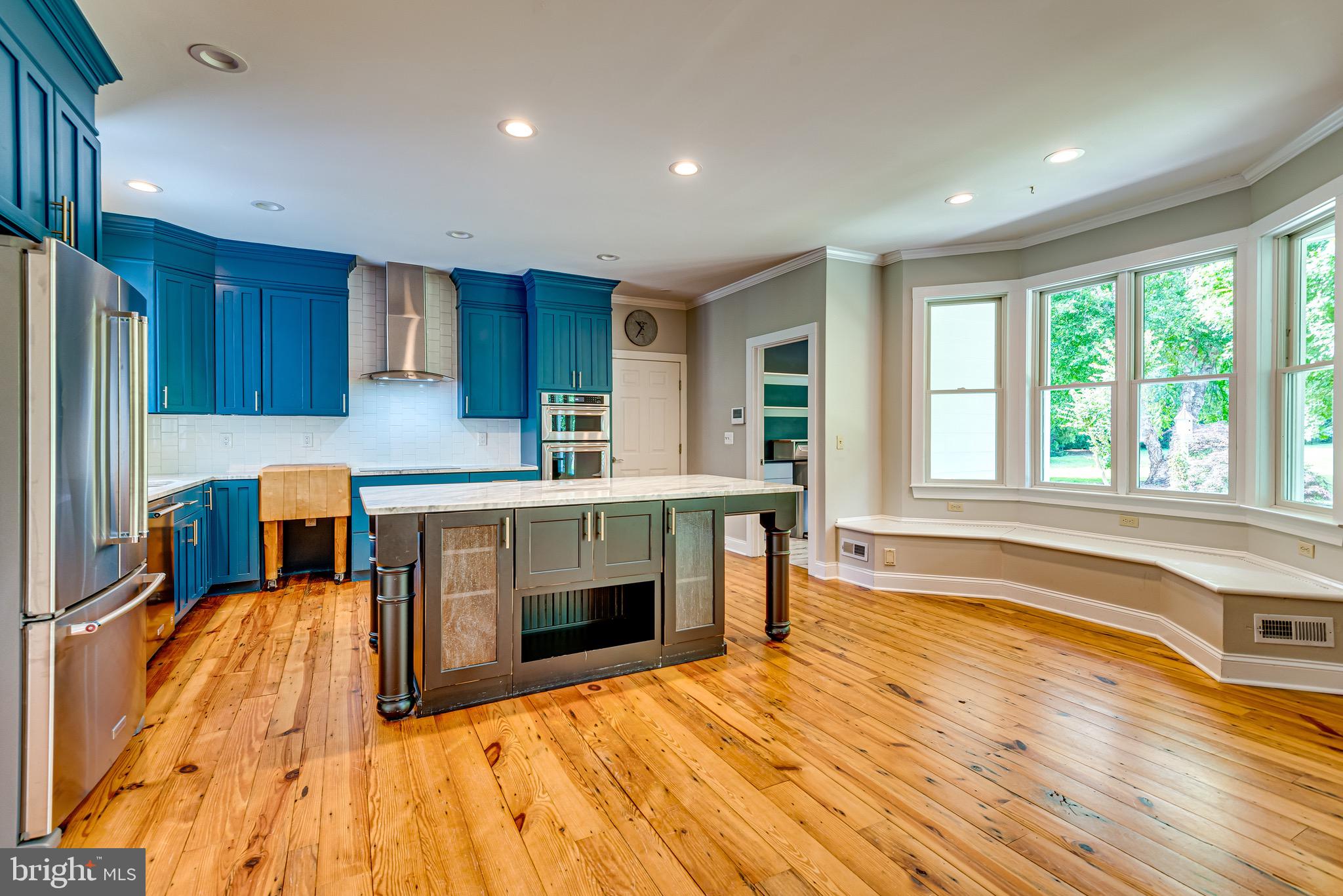 Kitchen with built in seating at bay window