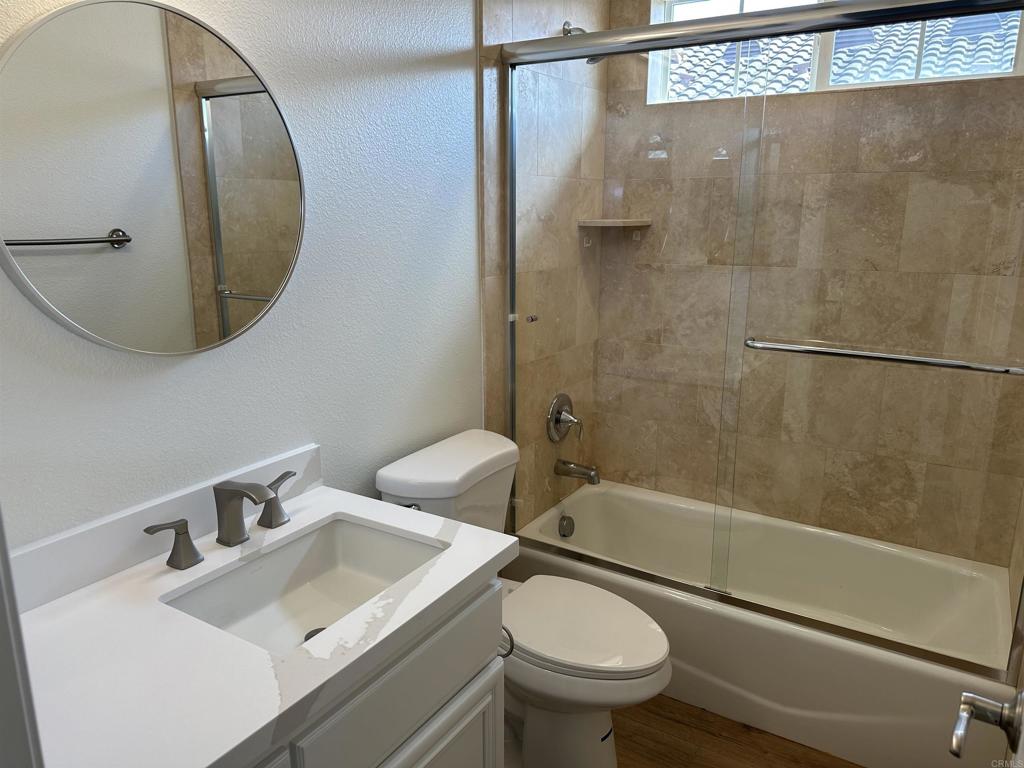 4026 Aidan Circle Carlsbad, CA 92008 - Photo 15 of 26 a bathroom with a sink toilet and shower