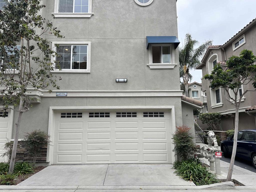 4026 Aidan Circle Carlsbad, CA 92008 - Photo 17 of 26 a view of a house with a door and a balcony