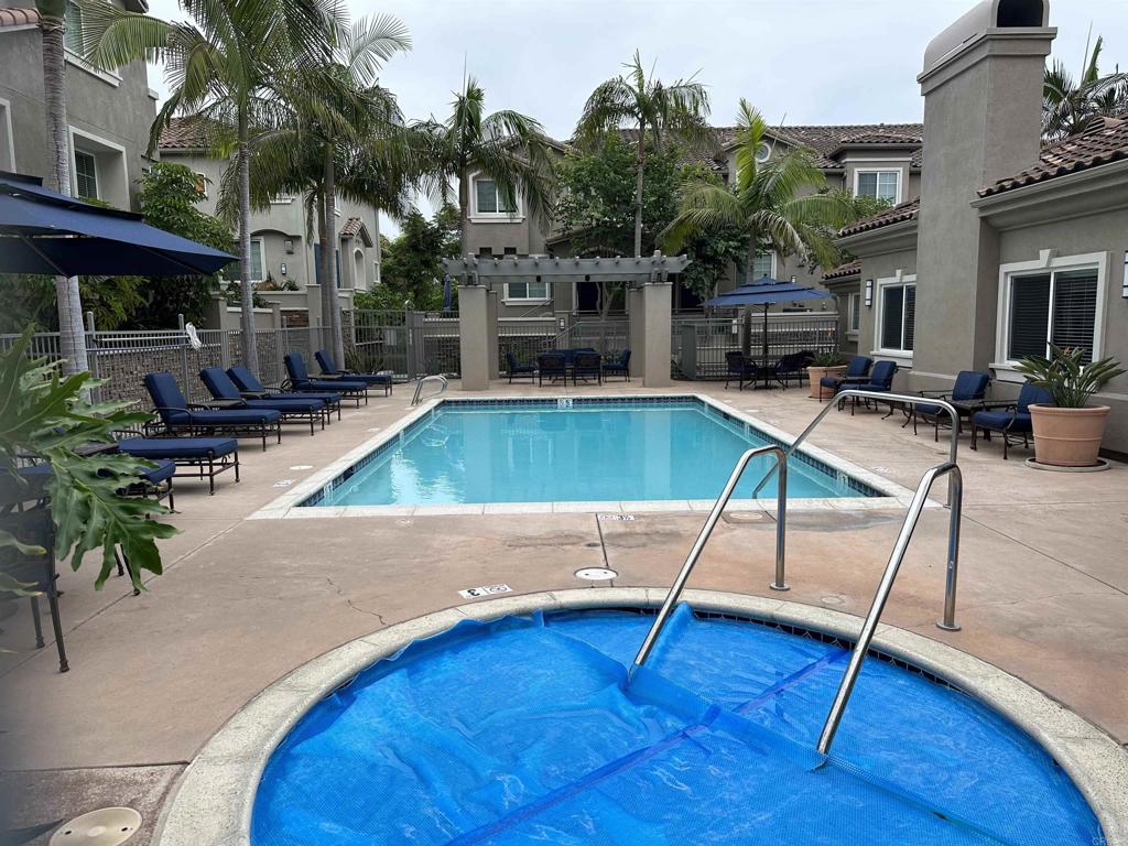 4026 Aidan Circle Carlsbad, CA 92008 - Photo 20 of 26 a wooden bench sitting in front of a building